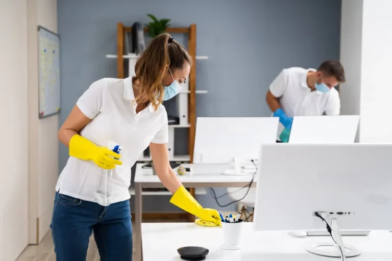 Janitorial staff cleaning a corporate lobby area