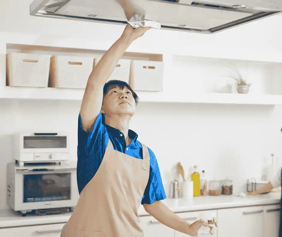 Professional cleaner wiping kitchen counter to fix common cleaning mistakes in Miami home